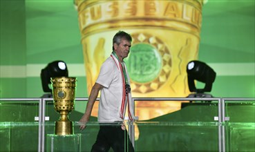 Coach of 1. FC Kaiserslautern Friedhelm Funkel walks past the cup in disappointment, 81st DFB Cup