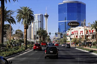 Las Vegas, Nevada, USA, North America, Street traffic with palm trees and skyscrapers in the