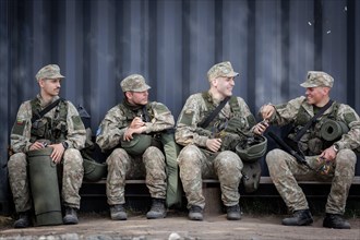 Young Lithuanian reserve soldiers take a lunch break during their training, taken in Rudninkai,