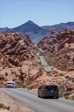 Traffic on Mouse's Tank Road winds between the red sandstone rock formations in Valley of Fire