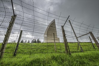 Barbed wire, memorial in the shape of a flame, Struthof concentration camp, Natzweiler, Alsace,