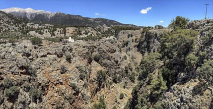 View to the northeast from bridge over Aradena gorge to rocks of Aradena gorge, small restored