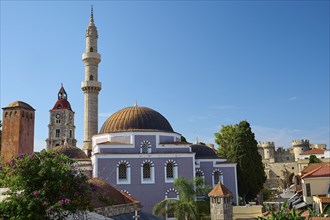 Suleiman Mosque, Historic building with minaret and domes, red roofs and fortress under blue sky,