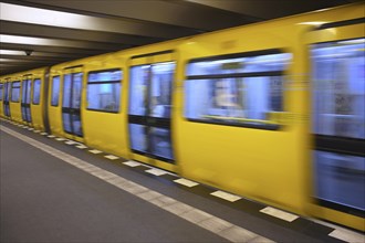 Arriving underground line U2, motion effect, stop, platform, Theodor-Heuss-Platz station, Berlin,