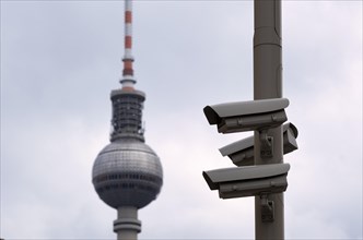 Surveillance camera at the Humboldt Forum, behind it the Alex television tower, Berlin, Germany,