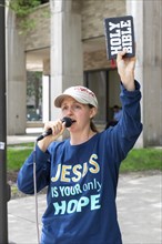 Detroit, Michigan, Reina LaCroix preaches for Jesus on the campus of Wayne State University. She is