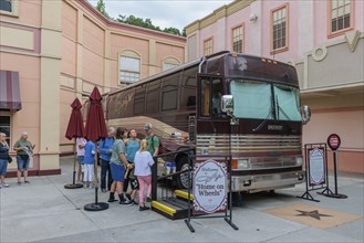 Guests line up to walk through Dolly's Home on Wheels tour bus at the Dollywood amusement park in