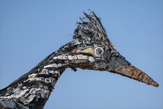Close up of Recycled Roadrunner statue made entirely from discarded materials by artist Olin Calk