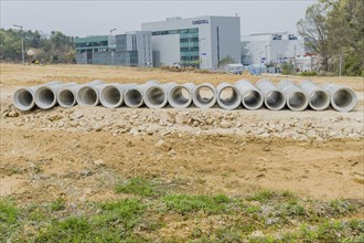 Row of concrete culvert pipes on ground at construction site in Daejeon, South Korea, Asia