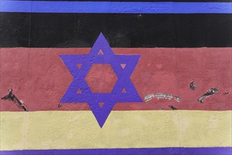 Mural German flag with Jewish star, artist Guenter shepherd, East Side Gallery, graffiti on the
