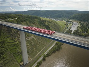 Trucks with a total weight of 960 tonnes stand on the Moselle valley bridge in Winningen during a