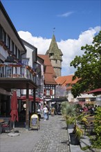Pedestrian zone at Holzmarkt with the green tower in the historic old town of Ravensburg, district