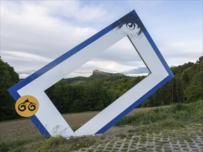 Picture frame as a photo spot, Vulkanlandroute 66, Riegersburg Castle in the background, near