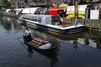 Cheese being transported during a traditional Dutch cheese market on a Friday in Holland. Alkmaar,