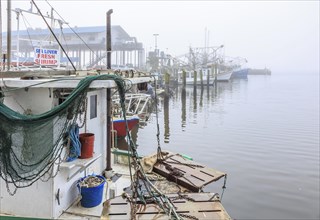 Commercial shrimp boats at the dock in the commercial area of the Biloxi Small Craft Harbor in