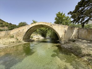 Frontal view of historic classical arched stone bridge in Venetian architectural style Venetian