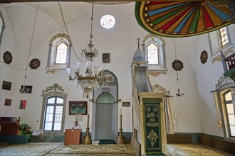 Retzep Pasha Mosque, Prayer room of a mosque with chandelier and decorative windows under a high