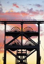 Double trestle scaffolding in front of a colourful sunrise, Gneisenau district park, Dortmund, Ruhr