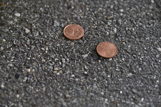 Money lying on the street, two five cent pieces, euro currency