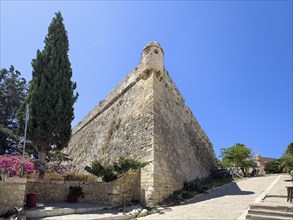 One of ten 10 round watchtowers on south-east side of ruins of historical fortress Fortetza