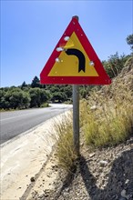 Bullet holes in road sign is target for target practice of bullets shot through, Crete, Greece,