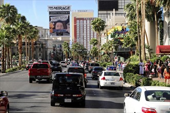 Las Vegas, Nevada, USA, North America, Street traffic with several cars and palm trees along the