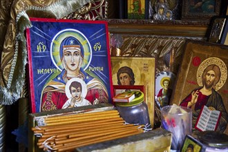 Rock chapel, Archangel Michael Panormitits, icons and religious objects on a devotional altar,