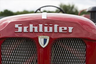 Schlueter tractor, lettering and company logo on red painted bonnet, Offenbach, Dreieich, Hesse,