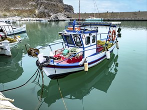 Small fishing boat in new harbour marina of Loutra east of Lentas on south coast of Crete island on