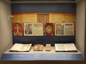 Showcase with historical handwritten books Gospels Church books of Arkadi Monastery in Museum