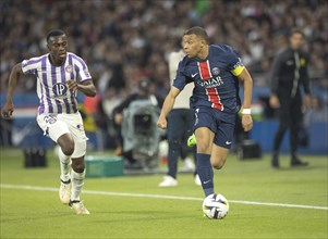 Football match, captain Kylian MBAPPE' Paris St. Germain running on the ball looking left, Kevin