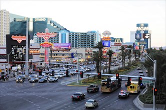 Las Vegas, Nevada, USA, North America, A busy street in a city with many cars, signs and people in