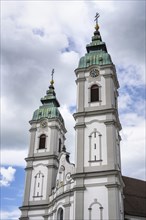 The twin towers of the Catholic parish church of St Peter, formerly the monastery church of the