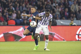 Football match, captain Kylian MBAPPE' Paris St. Germain left in a duel for the ball with Kevin