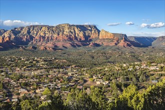The town of Sedona, Arizona in a valley surrounded by red limestone rock formations, USA, North