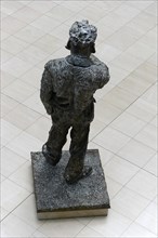 A bronze sculpture of a standing man seen from behind, Willy-Brandt-Haus, SPD Headquarters, Berlin,