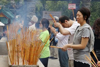 People praying in a temple, Hong Kong, Asia