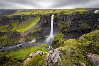 River and waterfalls at a canyon with green moss, Haifoss and Granni waterfall at a canyon, Fossá í