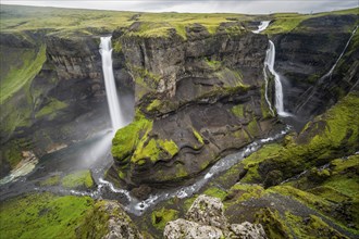 River and waterfalls at a canyon with green moss, Haifoss and Granni waterfall at a canyon, Fossá í