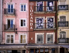 Italian restaurant Locanda, house facade with large photos of Italian film stars with spaghetti,