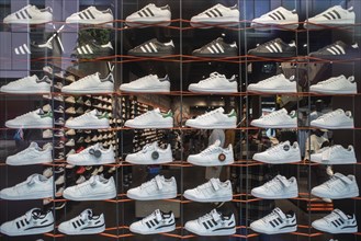 Presentation in a shop window of sports shoes in a sports shop, Bavaria, Germany, Europe