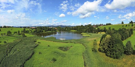 Aerial view of the Bachtelweiher near Kempten with a view of the Allgäu Alps. Sankt Mang, Kempten,