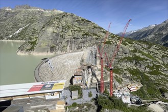 View of construction site of new dam for enlargement of reservoir Grimselsee replacement dam