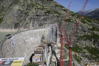 View of construction site of new dam for enlargement of reservoir Grimselsee replacement dam