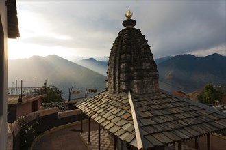 A minor temple at Bhimakali Temple complex overlooks the view of the Himalayas in Sarahan, Himachal