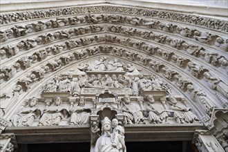 Detail of the main portal of Notre Dame Cathedral, Paris, FranceParis, France, Europe. Complex