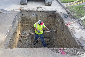 Detroit, Michigan, Workers replace old lead water service lines with copper pipes. Lead is harmful