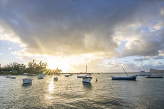 Landscape with a view over a small harbour with fishing boats. Tropical landscape with a view of