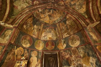 A frescoed church interior showing circular portraits and religious art, Byzantine Chapel of Agios