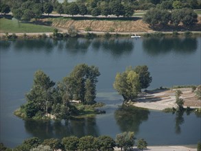 Serene scene with a river, small islands and lush trees, Vienna, Austria, Europe